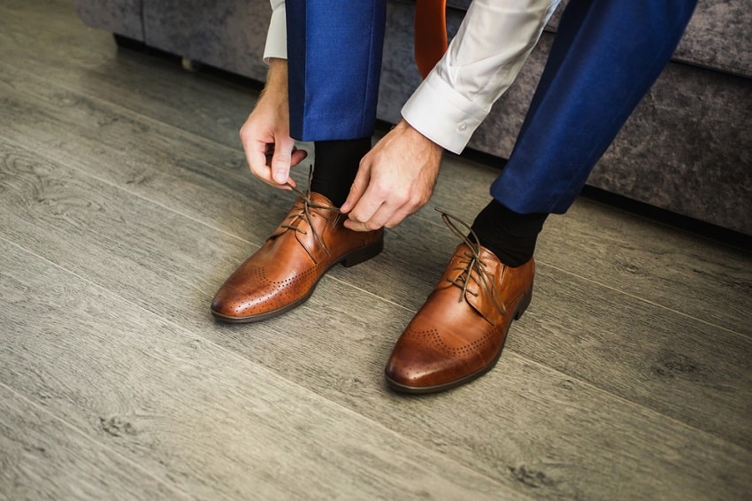 blue shirt khaki pants brown shoes