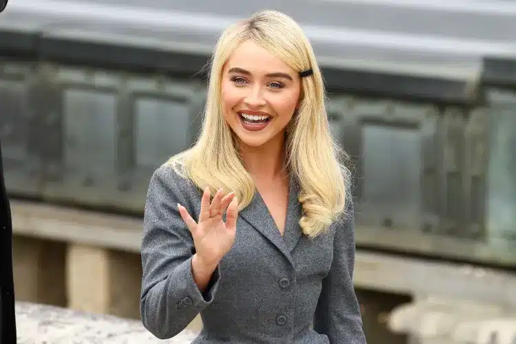 Sabrina Carpenter pantsless accessories look hair transformation baby blue puffer jacket plaid scarf