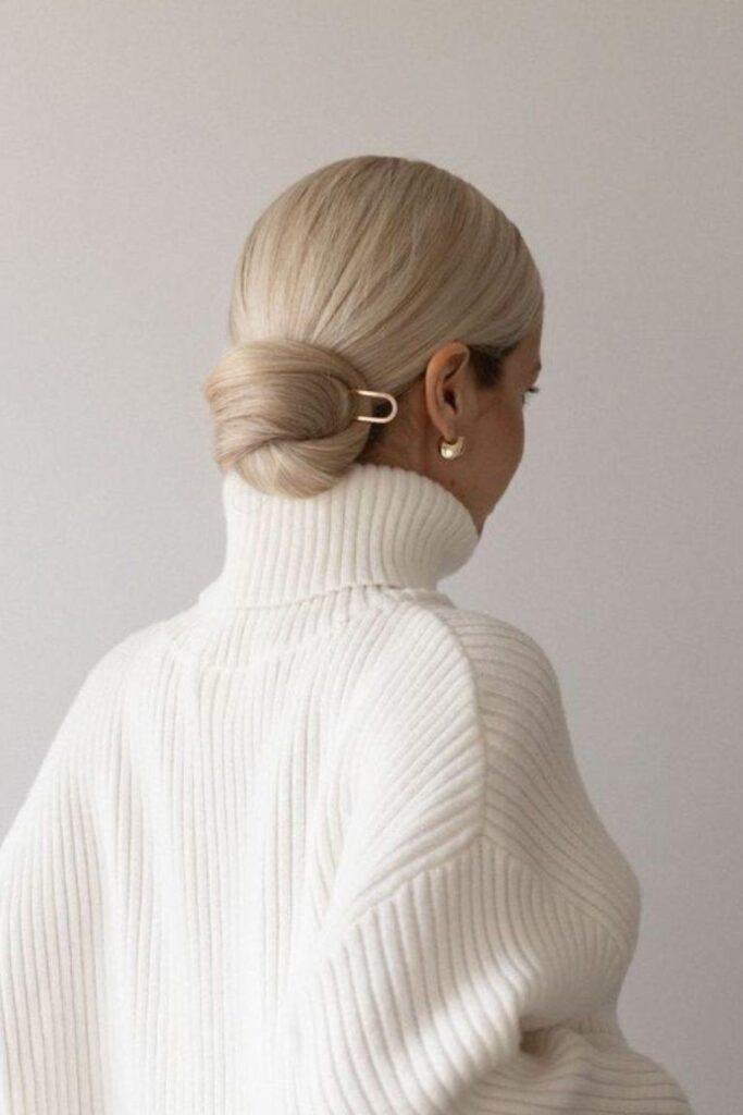 1. High Necklines and Structured Hairstyles